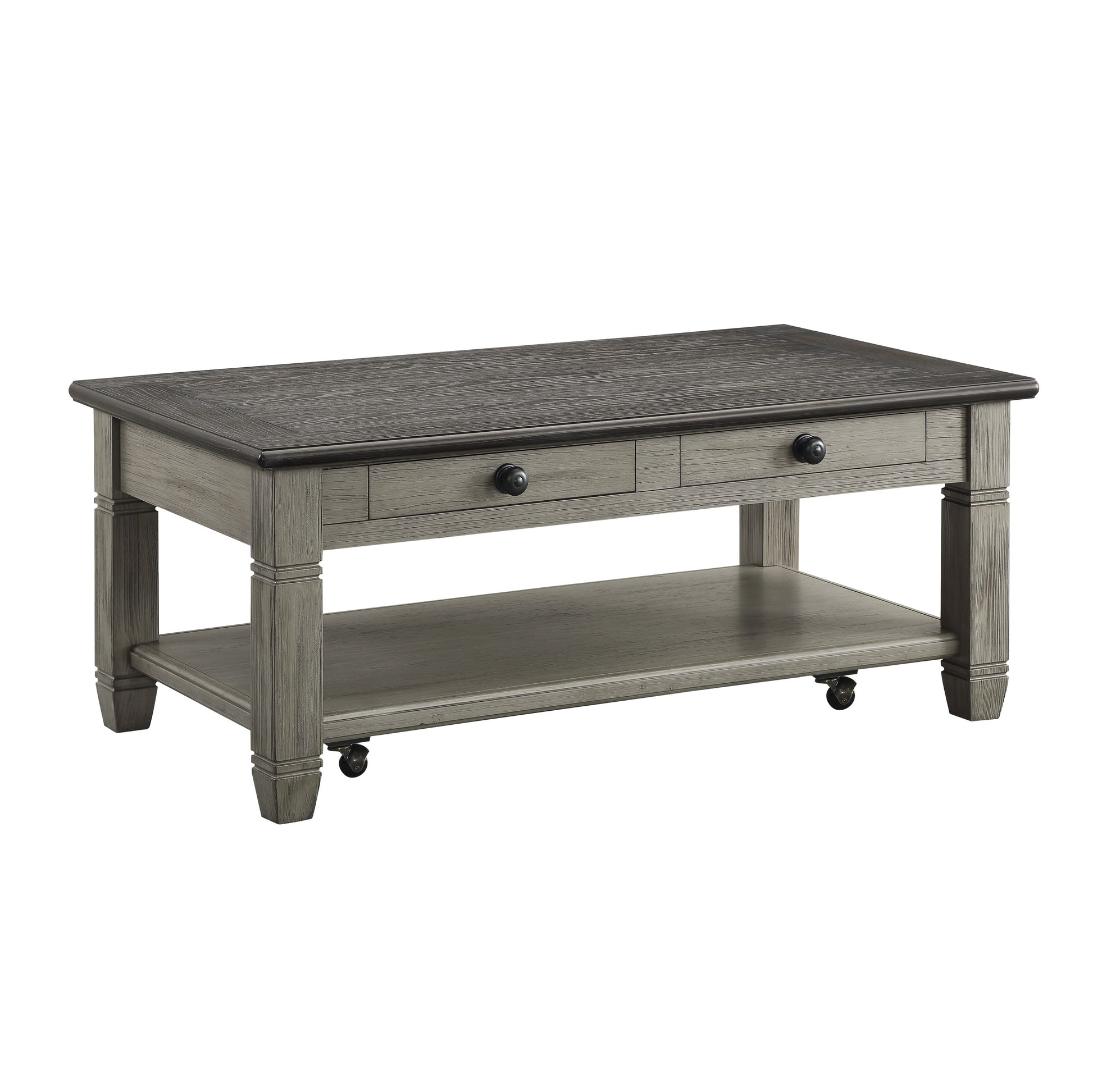 Rustic grey wood coffee table with two drawers and a lower shelf on casters