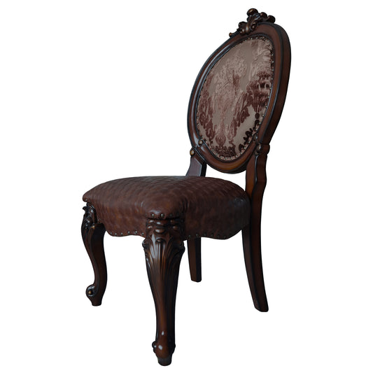 Ornate carved wooden chair with brown diamondquilted leather seat