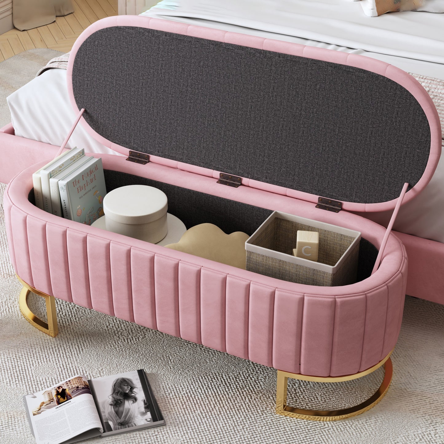 Pink velvet storage ottoman with gold legs