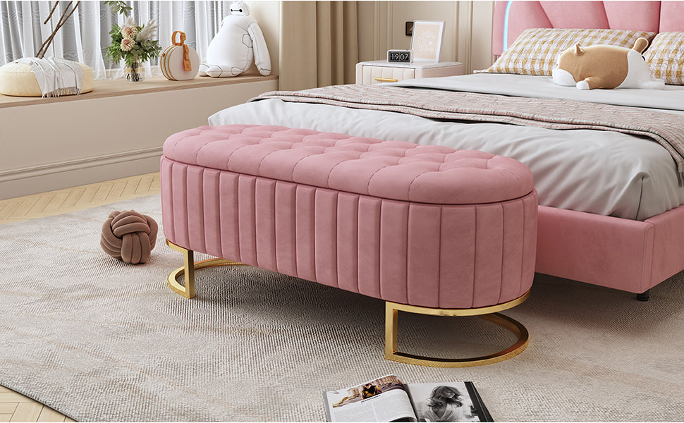 Pink velvet storage ottoman with gold legs