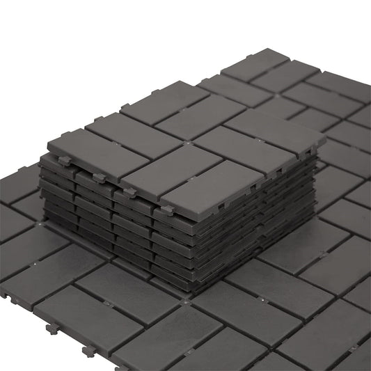 Stack of dark gray interlocking deck tiles ideal for patio flooring