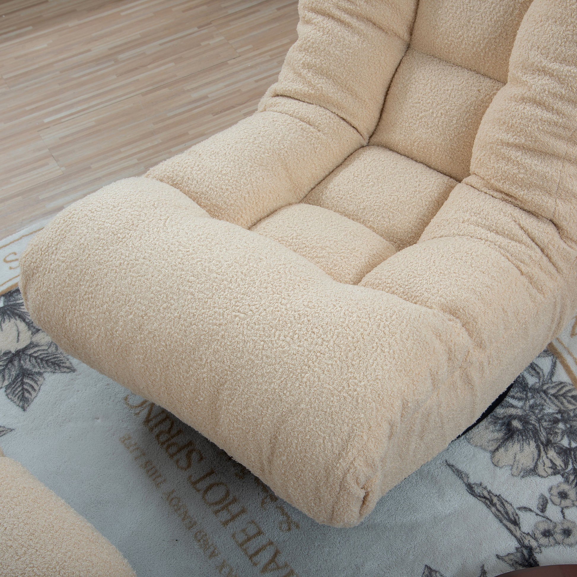 Comfortable cream teddy fabric floor chair with plush tufted seat and back