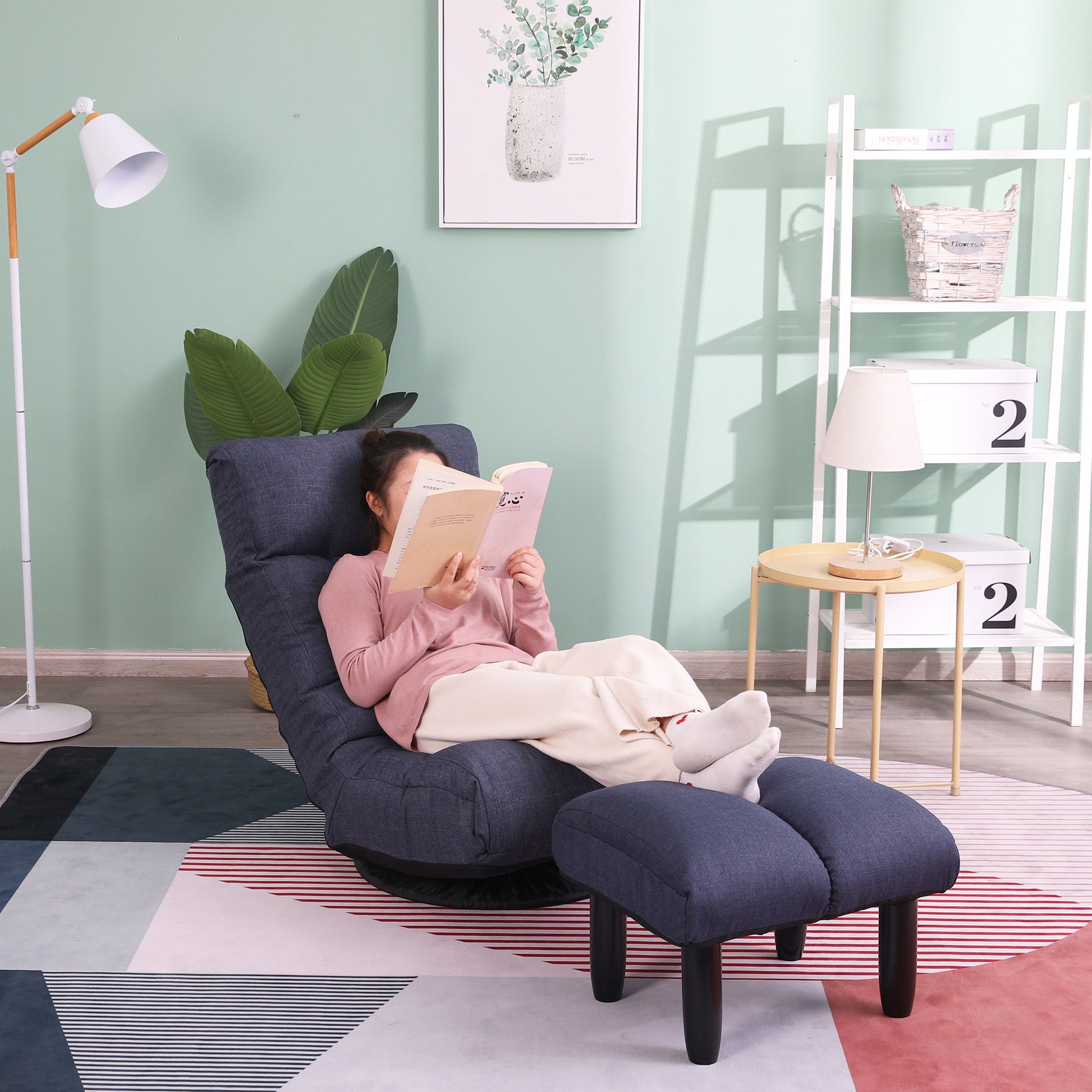 Dark grey adjustable floor chair with ottoman perfect for reading or gaming sessions