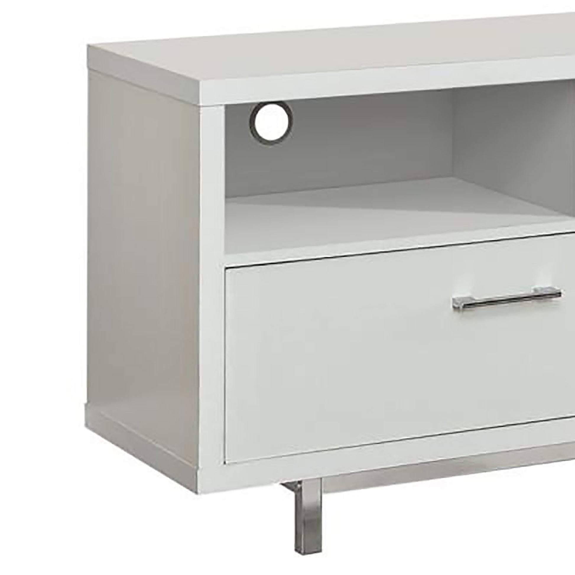 Modern white media console with open shelf and chrome drawer pull