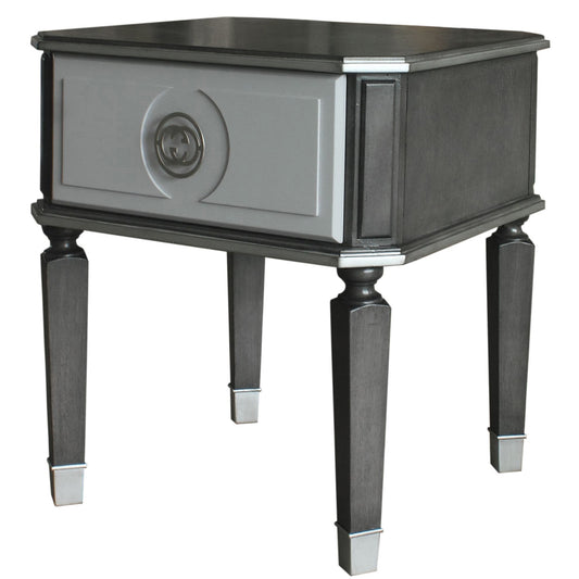 Charcoal grey wood end table with a single gray drawer featuring a silver double G logo emblem