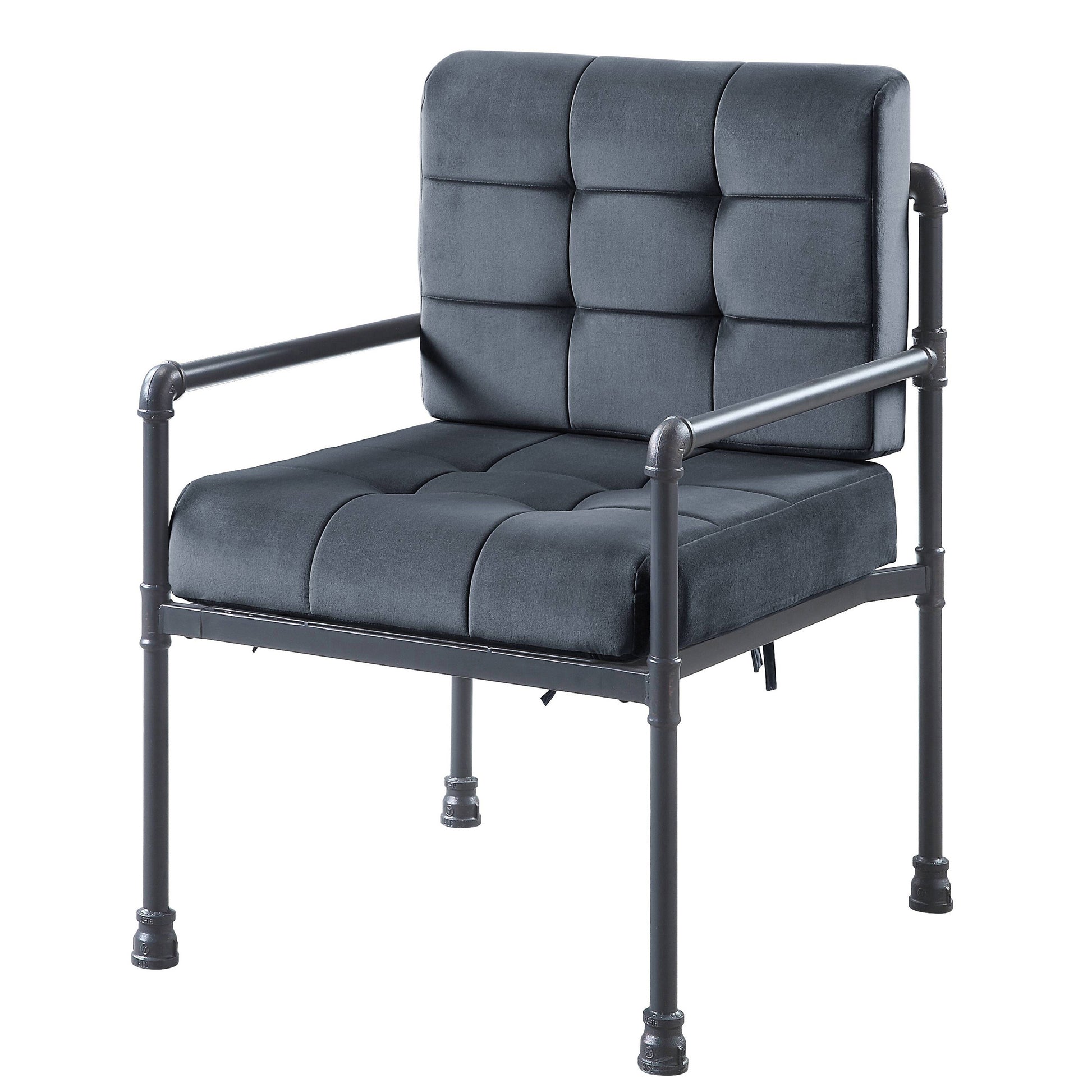 Dark gray velvet armchair with tufted cushions and industrial pipe frame