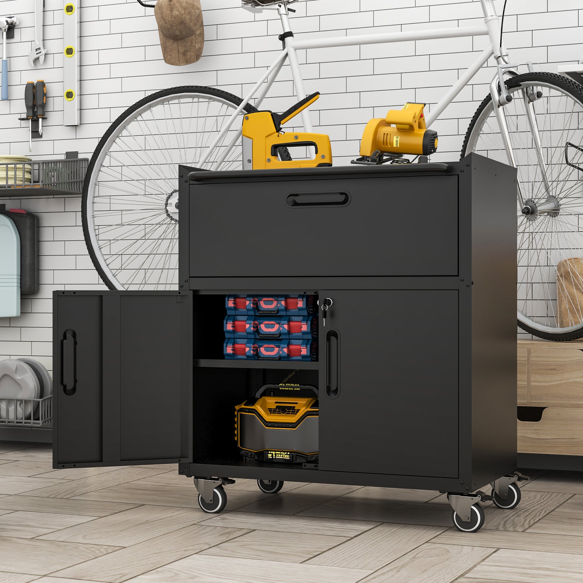 Black rolling tool chest with three organizer boxes and a battery pack inside