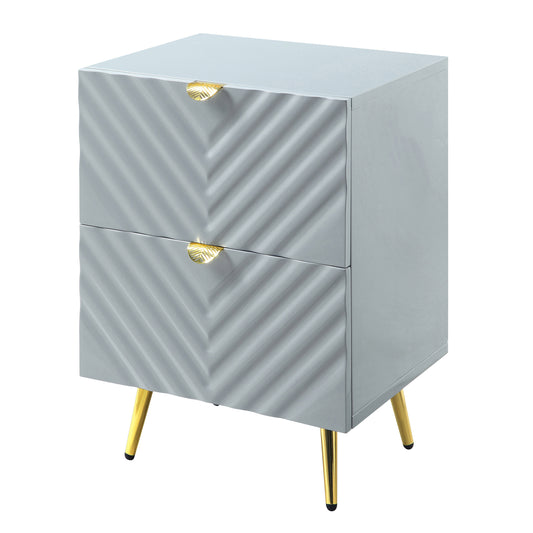Gray modern nightstand with gold leaf drawer pulls and tapered legs