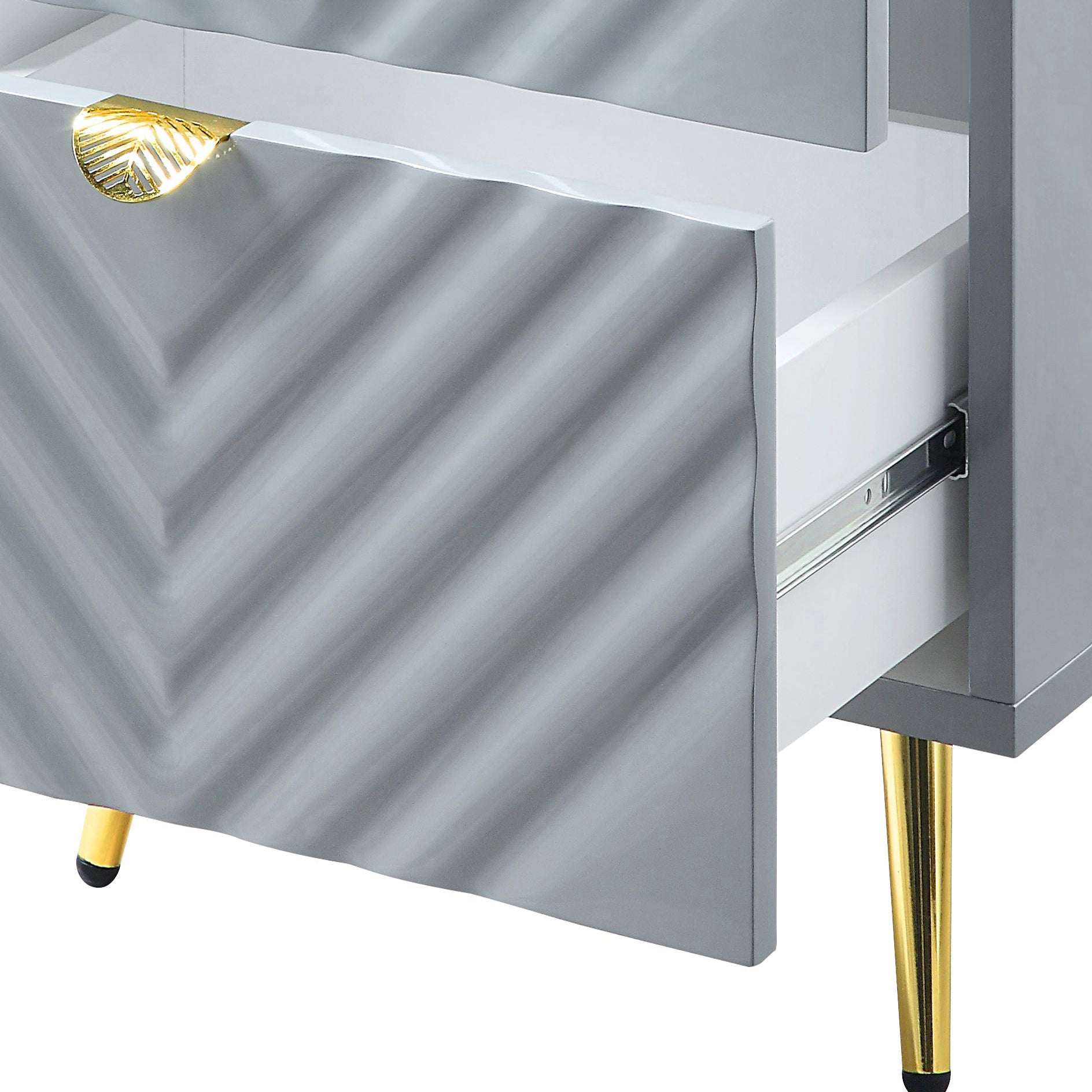 Grey chevron patterned nightstand with gold leaf drawer pull and tapered legs