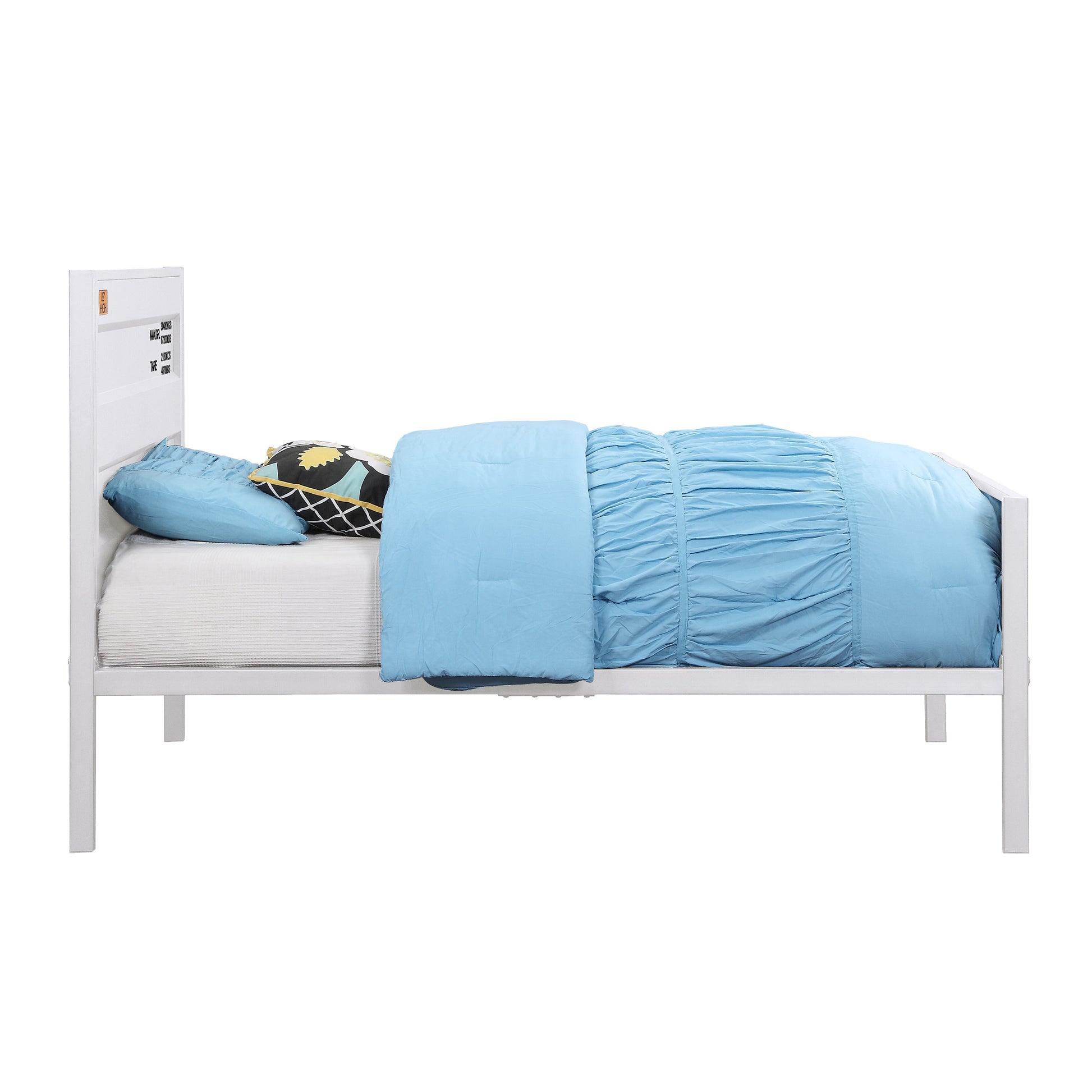 White metal twin bed frame with blue bedding and patterned pillows