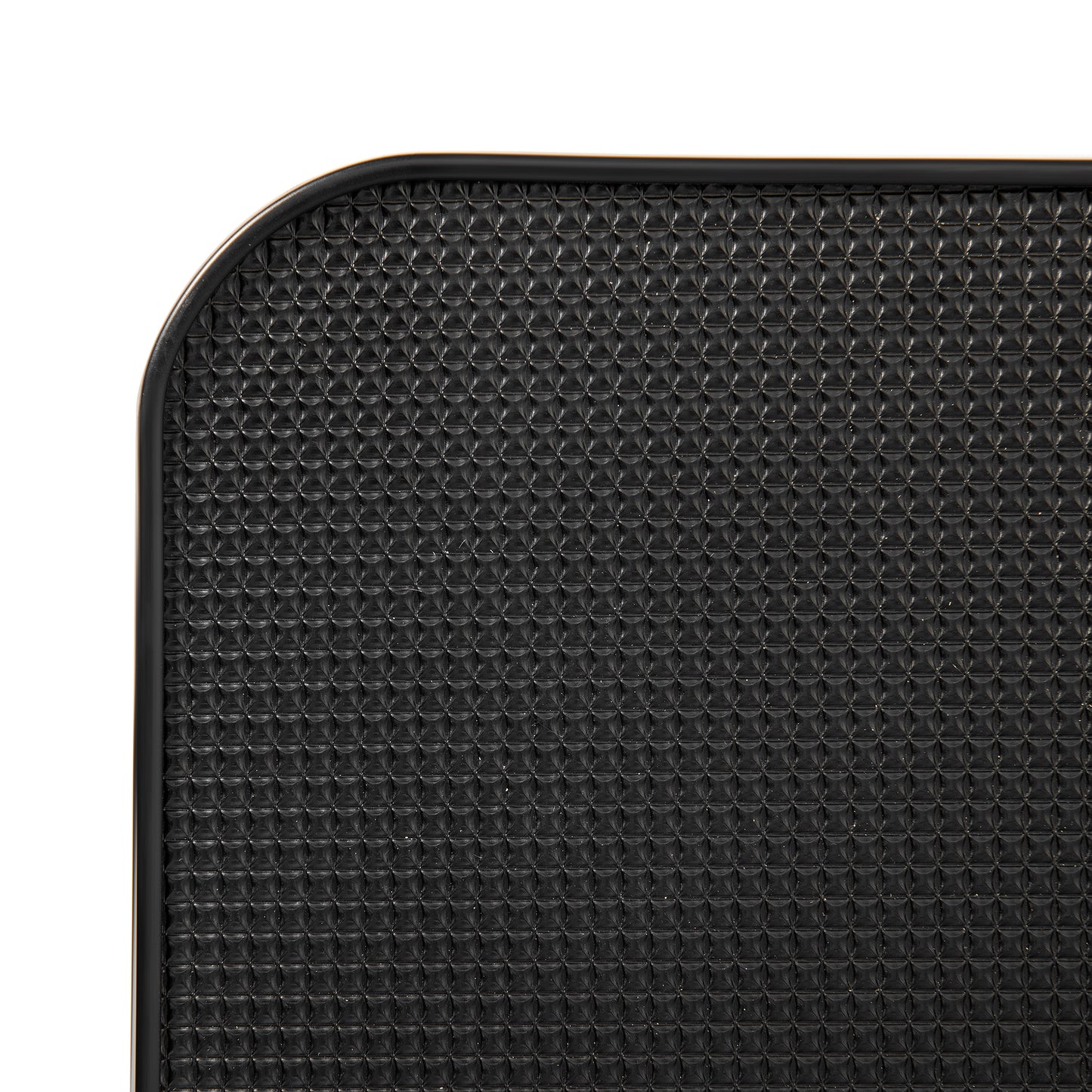 Black textured yoga mat with rounded corner detail for grip and stability