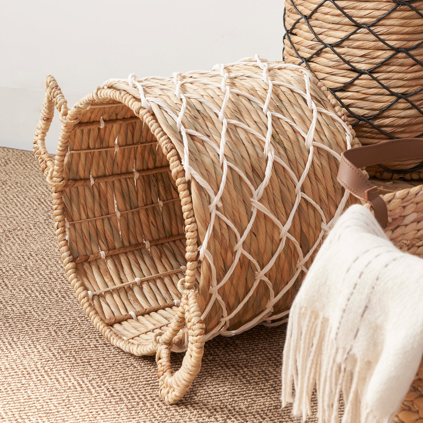 Natural woven hyacinth storage basket with white rope accents