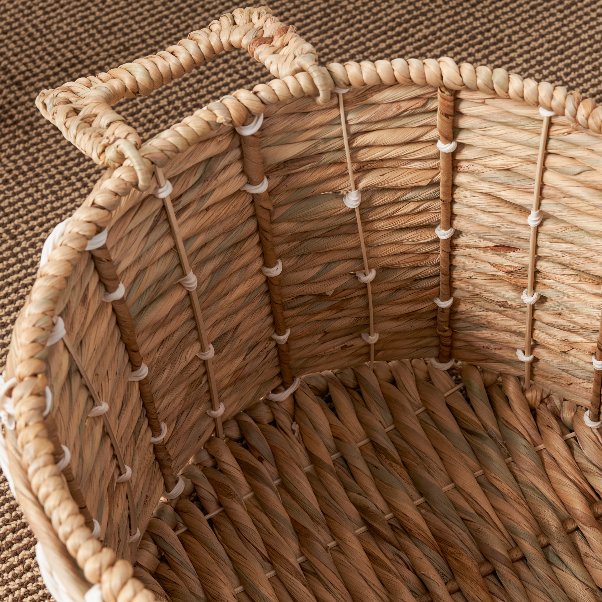 Natural woven storage basket with sturdy handles perfect for home organization