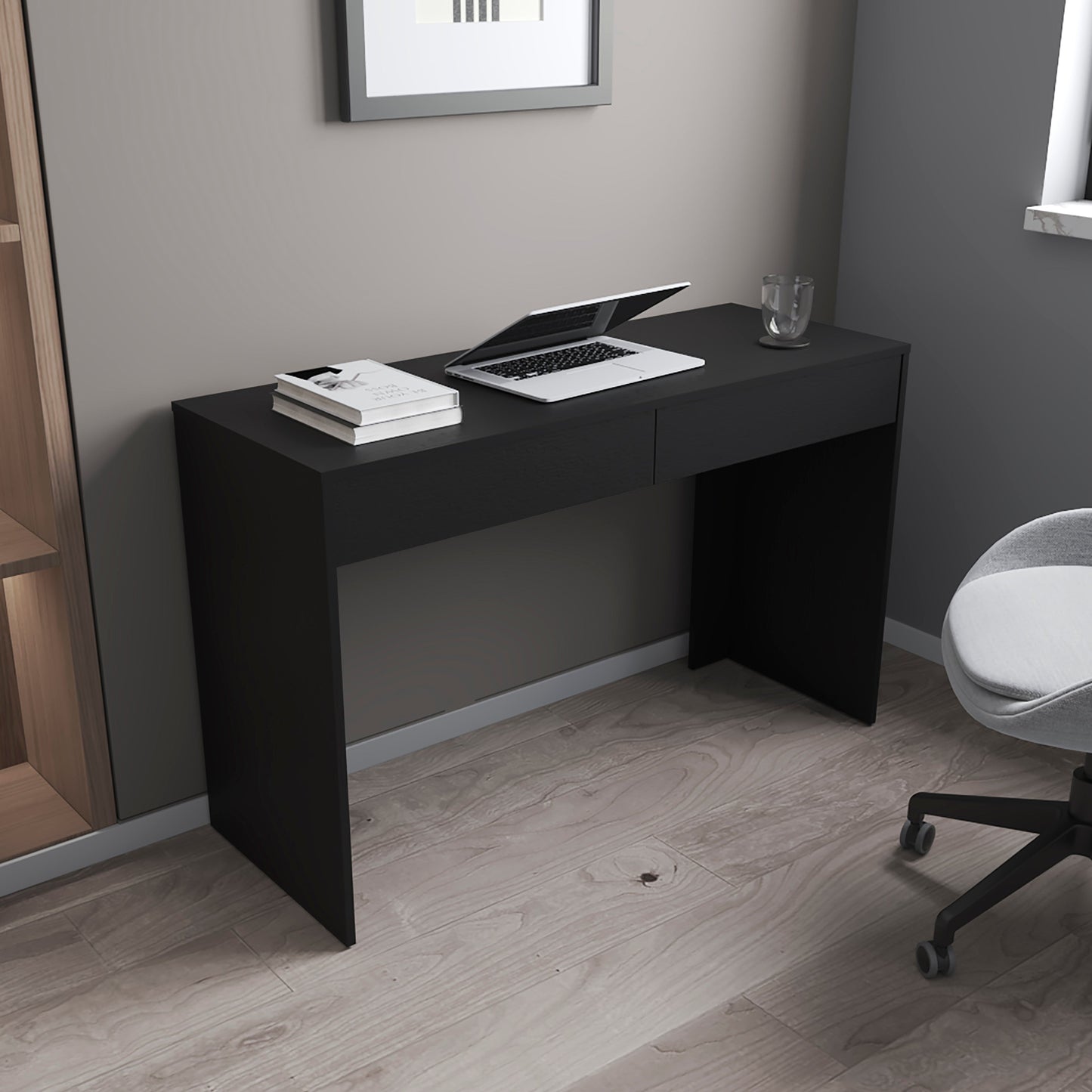 Sleek black modern desk with laptop books and glass ideal for home office use