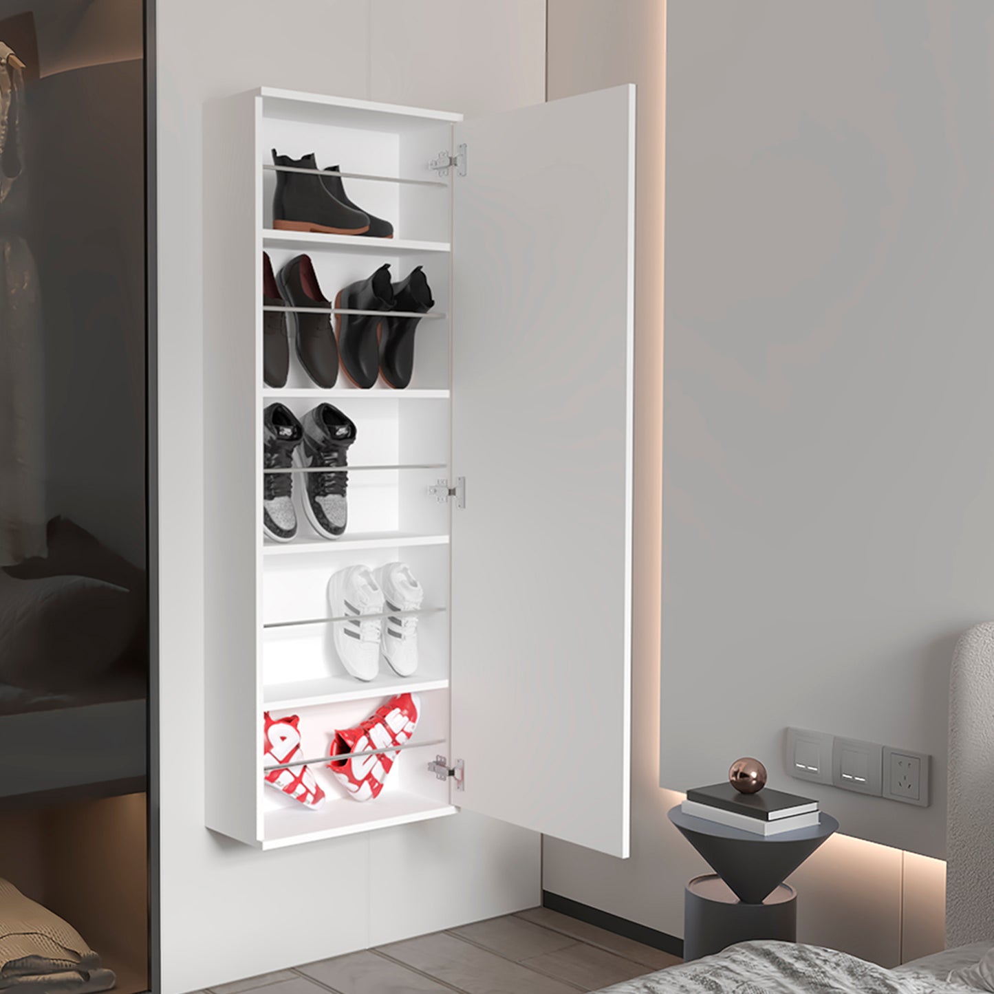 White wallmounted shoe cabinet with black boots and oxfords