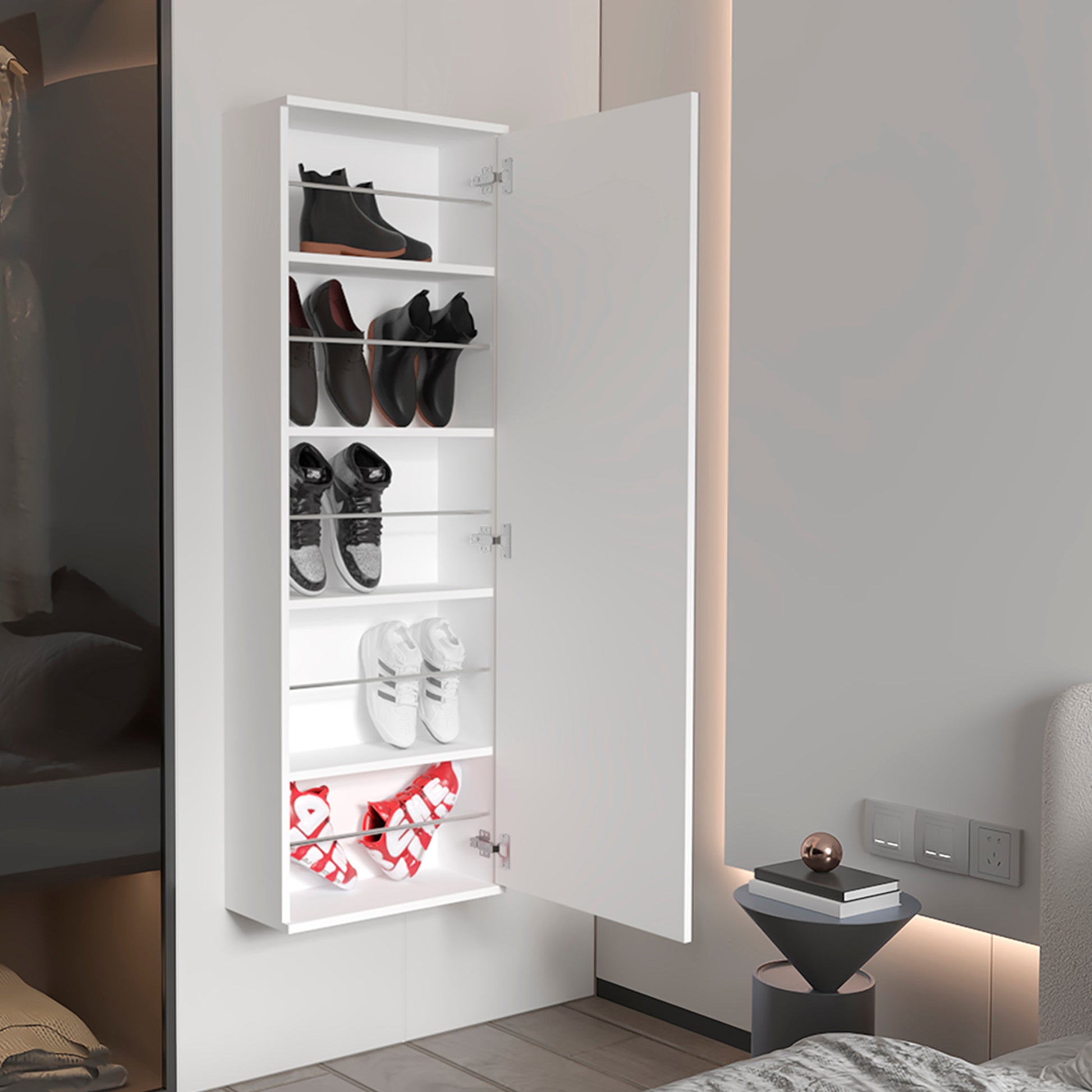 White wallmounted shoe cabinet with black boots and oxfords