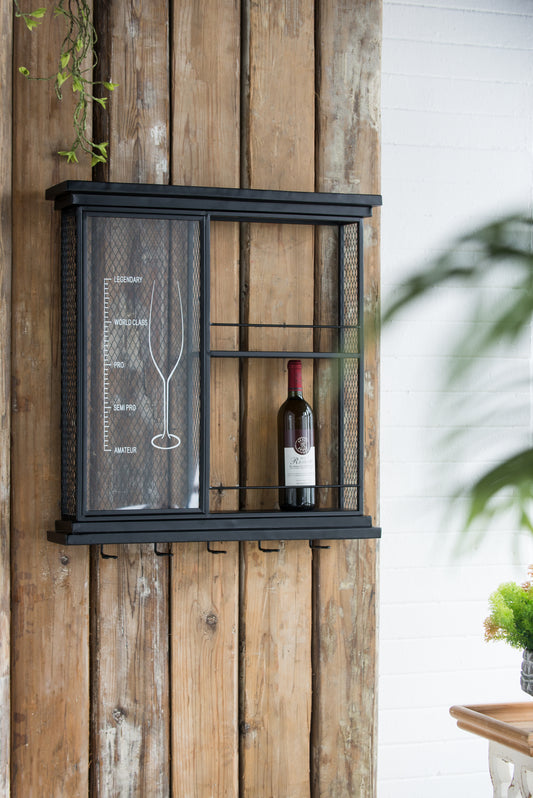 Black metal wine rack with glass etching on rustic wood background