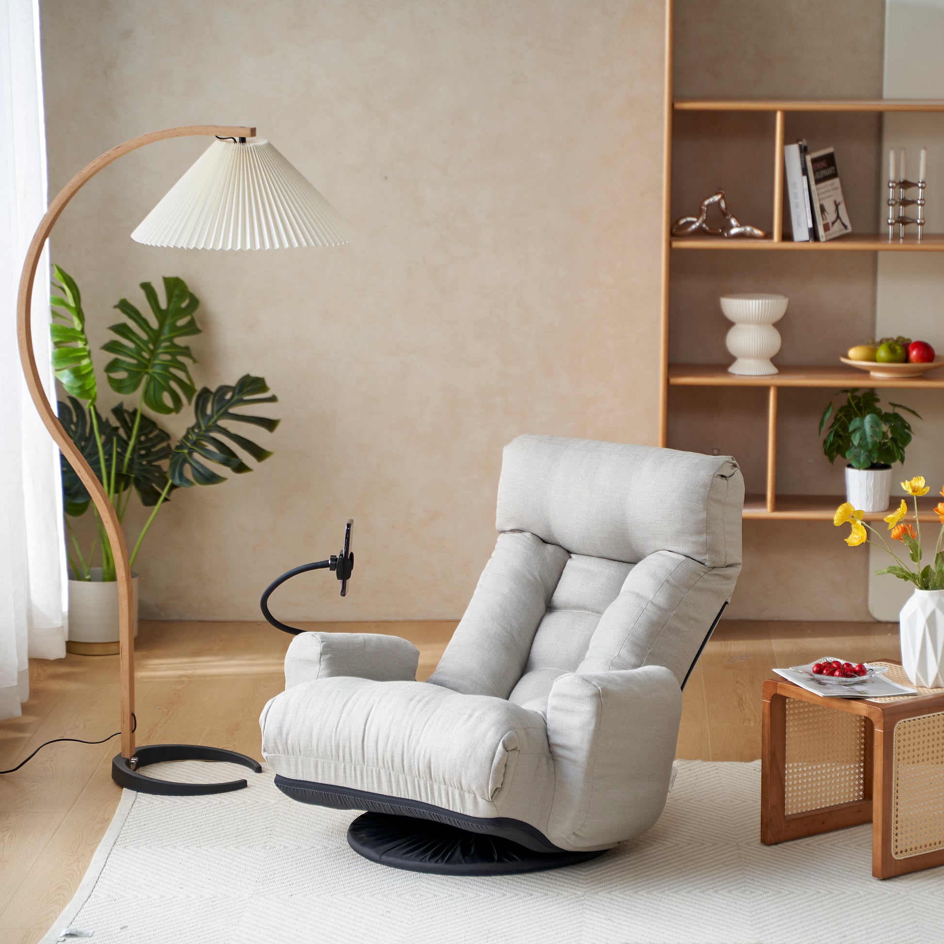 Light grey linen floor chair with adjustable backrest and swivel base perfect for modern living rooms