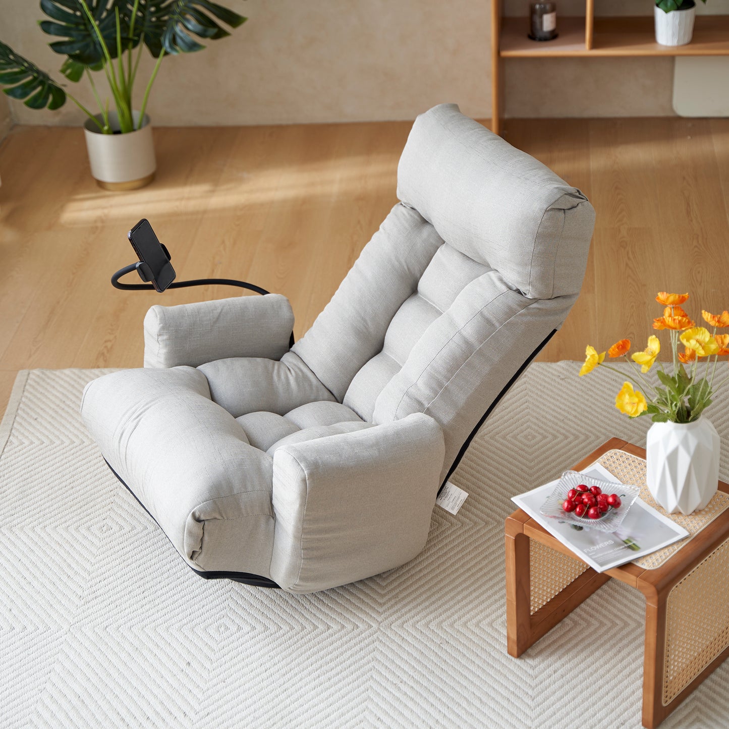Adjustable grey floor chair with integrated phone holder perfect for comfortable lounging