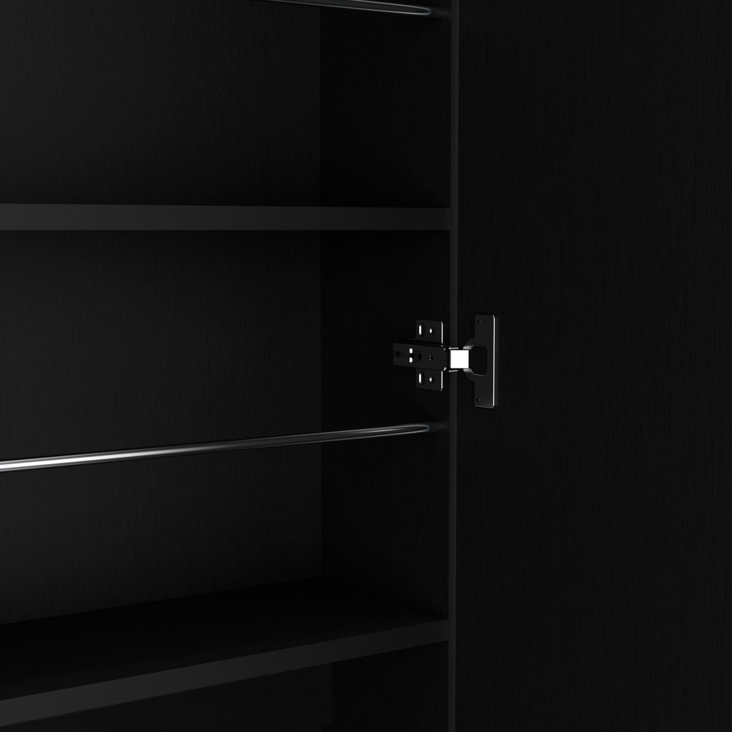 Black wardrobe interior with silver hanging rail and metal door hinge