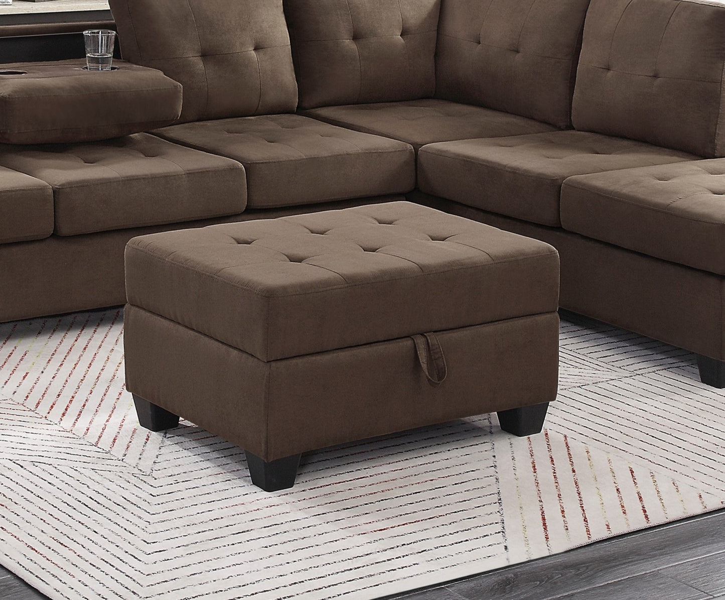 Brown tufted storage ottoman with dark wood legs complementing a sectional sofa