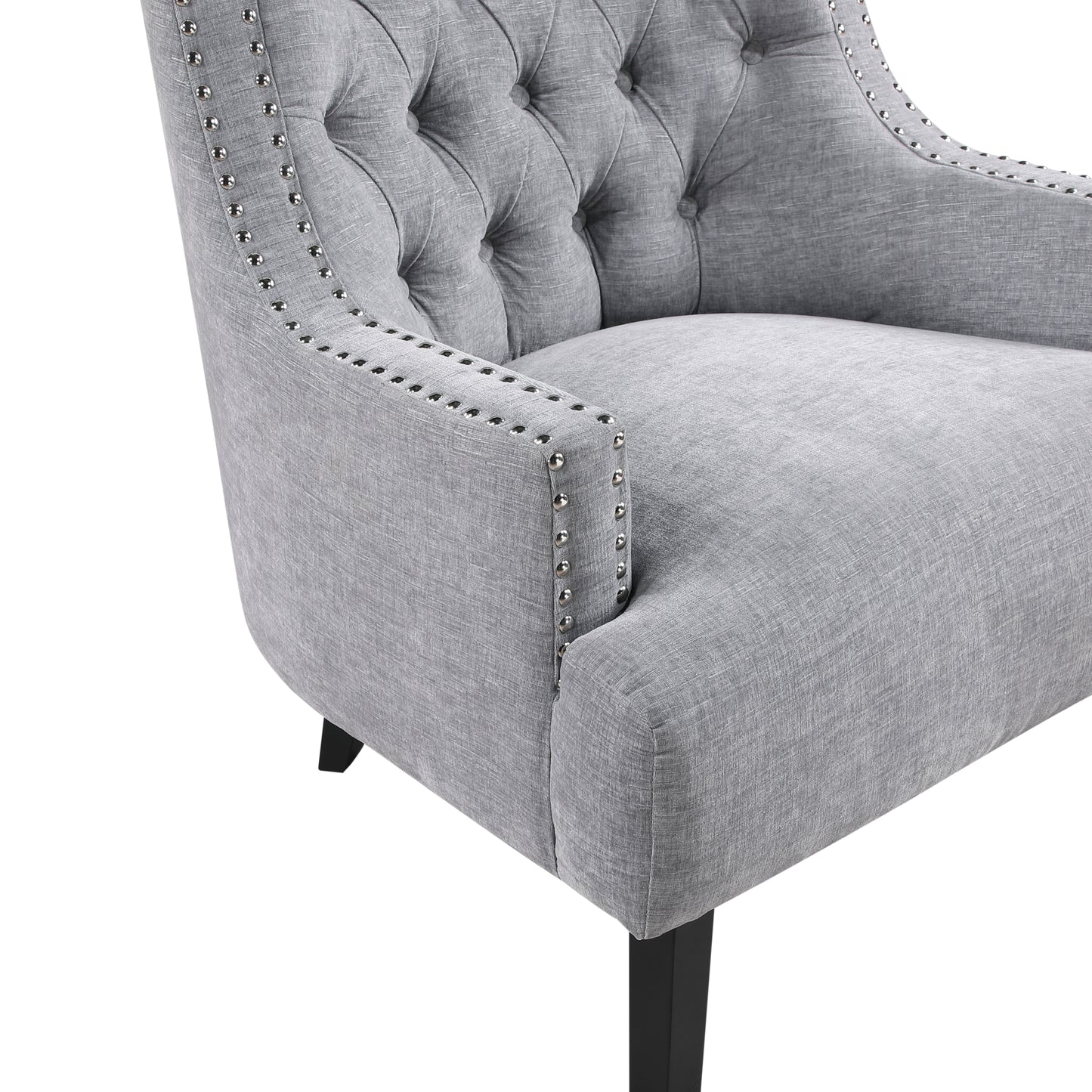 Tufted grey accent chair with silver nailhead trim and dark wooden legs