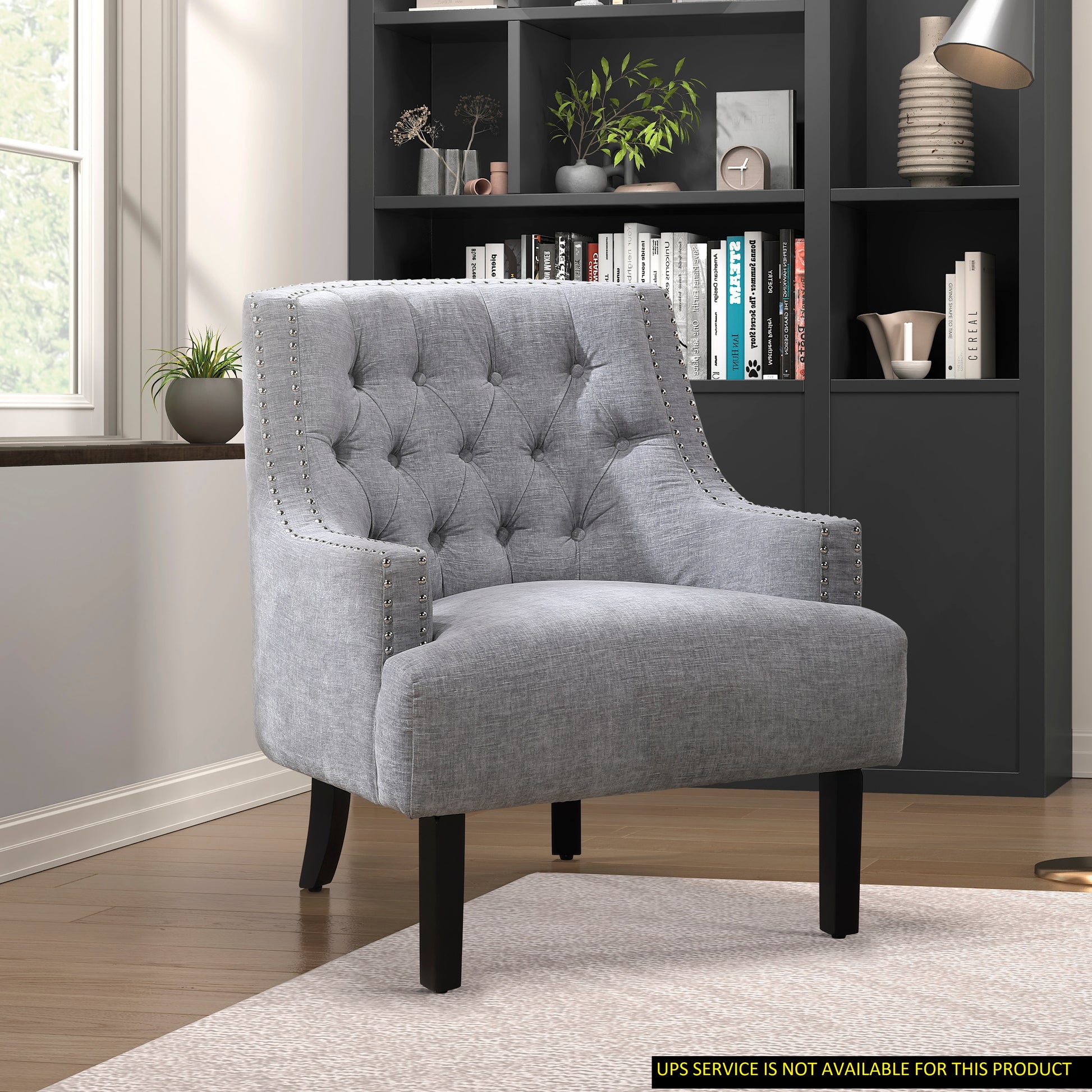 Tufted gray accent chair with nailhead trim dark wooden legs ideal for living rooms
