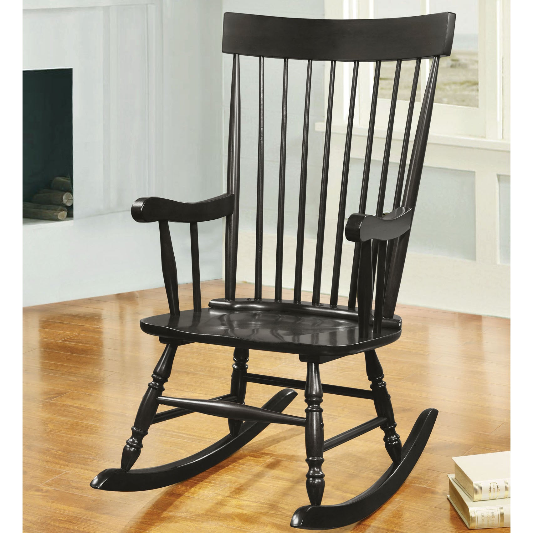 Classic black wooden rocking chair with spindle back and curved armrests