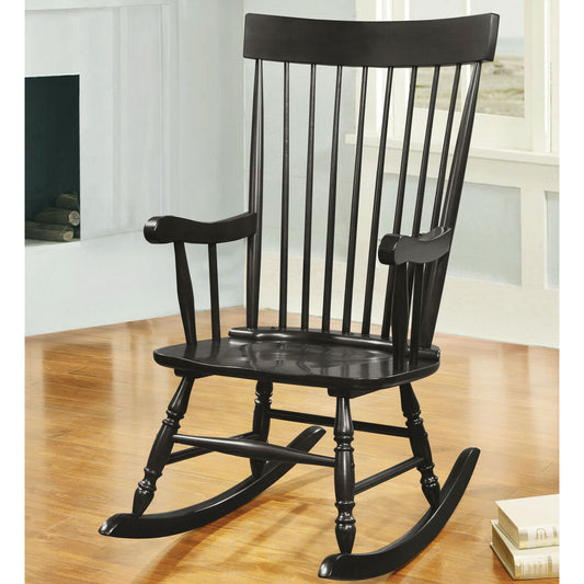 Classic black wooden rocking chair with spindle back and curved armrests