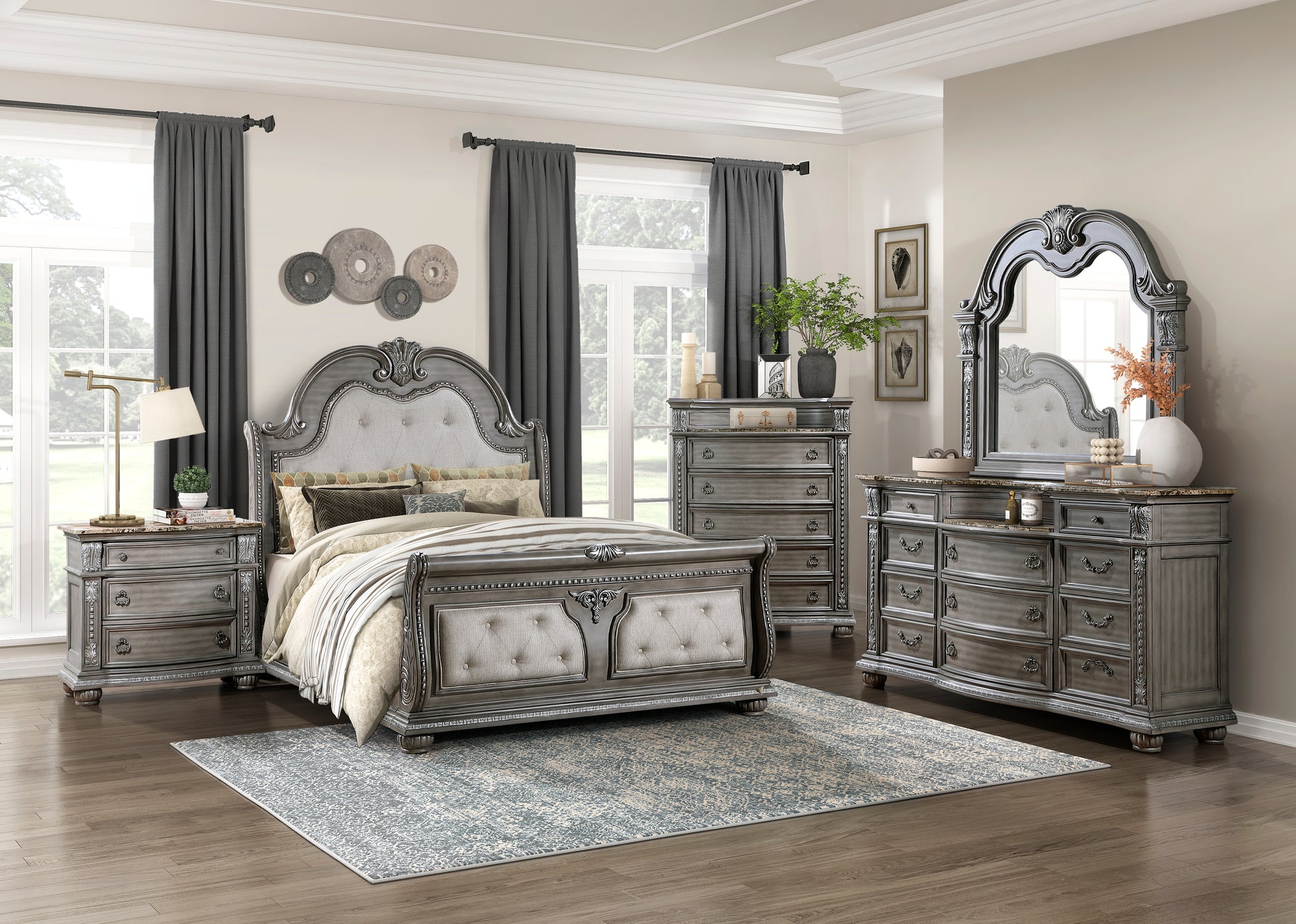 Ornate grey tufted queen bed frame with carved wood details and decorative pillows for master bedroom