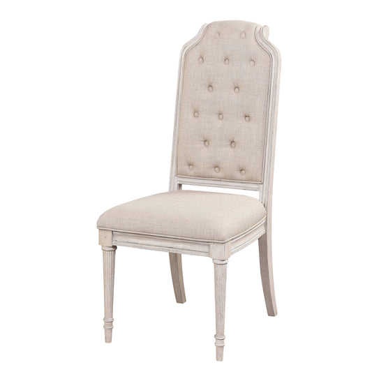 Tufted upholstered dining chair with a distressed white frame and beige fabric seat
