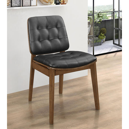 Tufted black leather dining chair with a natural wood frame modern design
