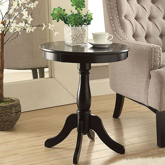 Dark wood round accent table with carved pedestal base ideal for living rooms