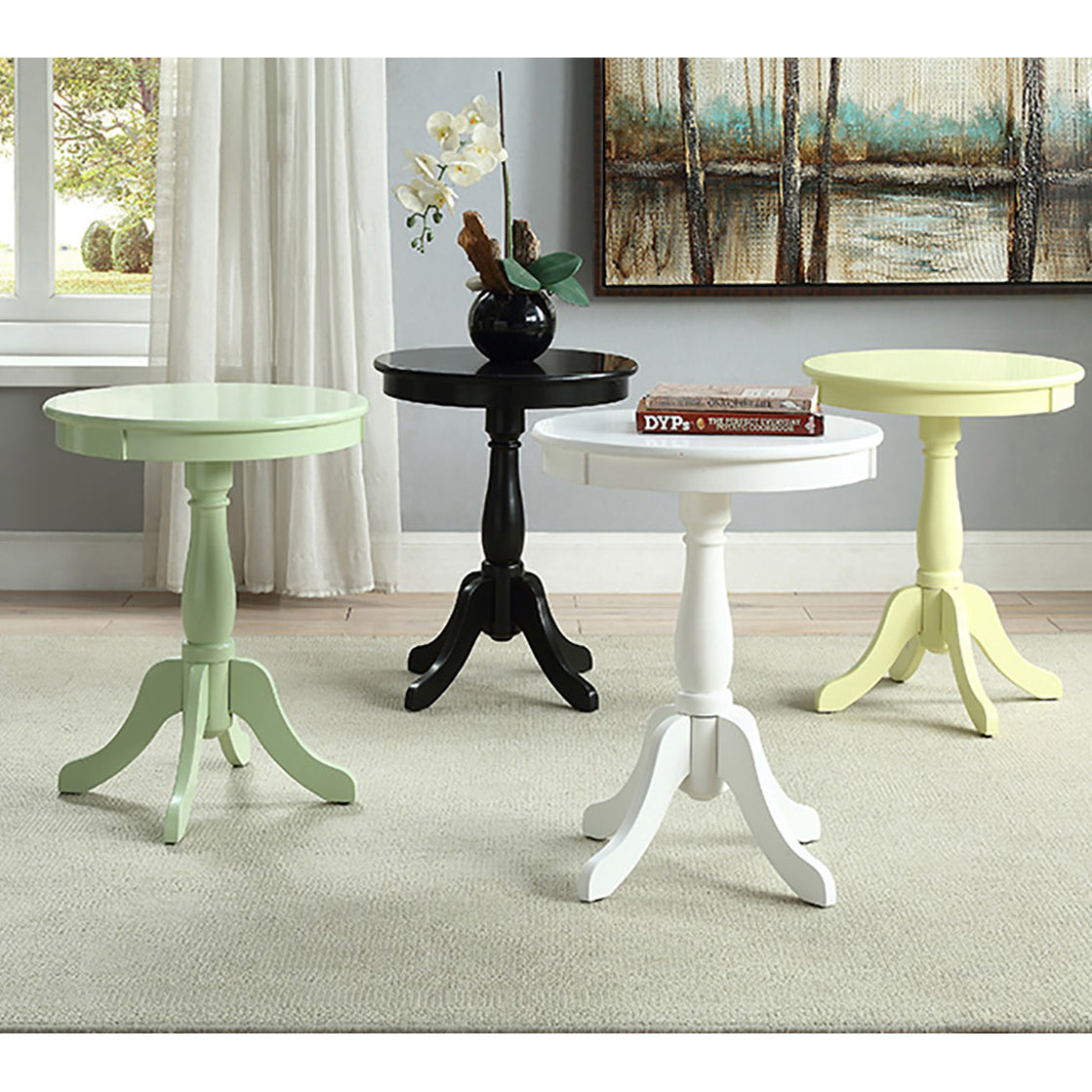 Pale green wooden pedestal side table with three splayed legs and circular top
