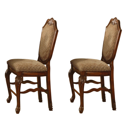 Ornate carved wooden dining chair with upholstered diamondpatterned seat and back