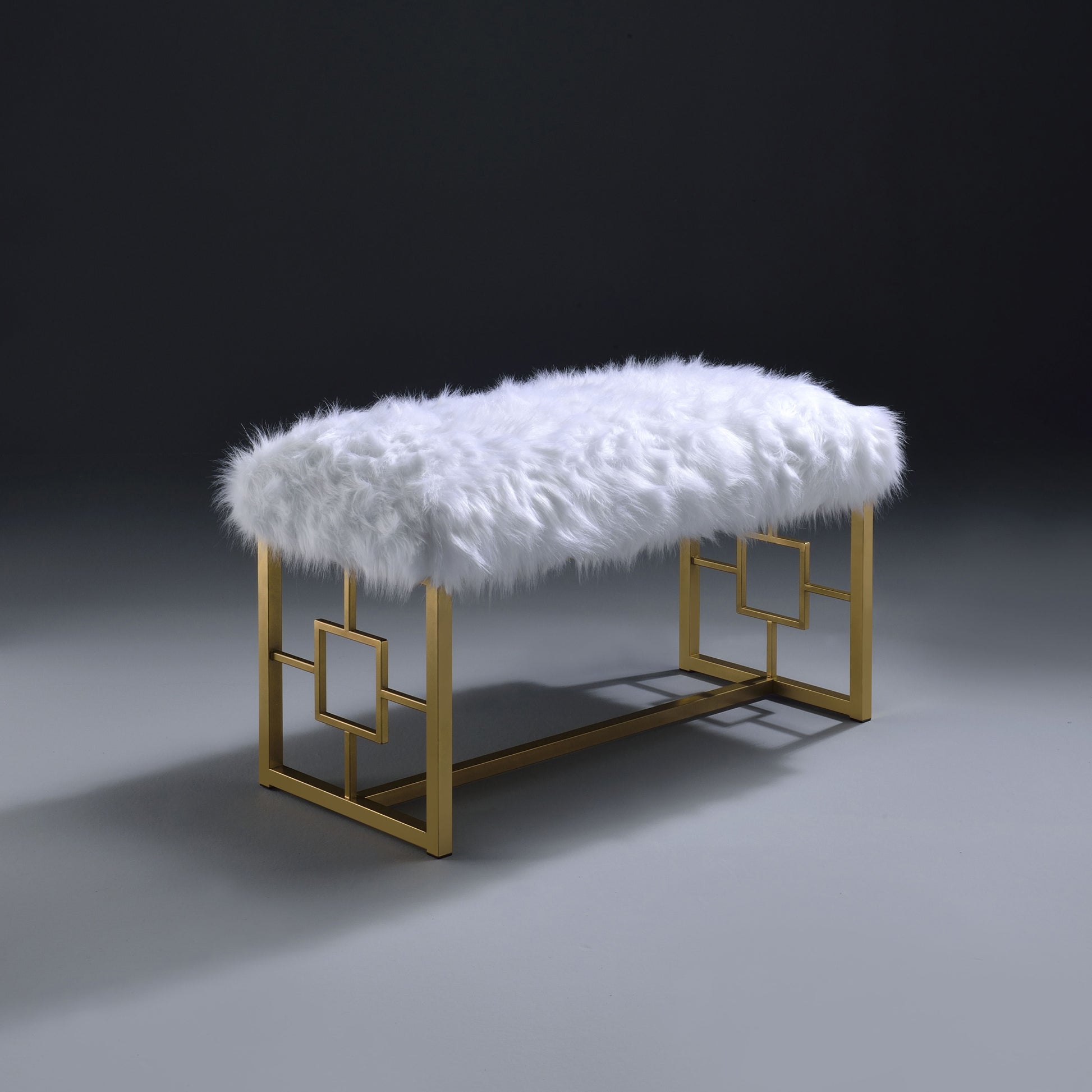 White faux fur bench with a gold geometric frame