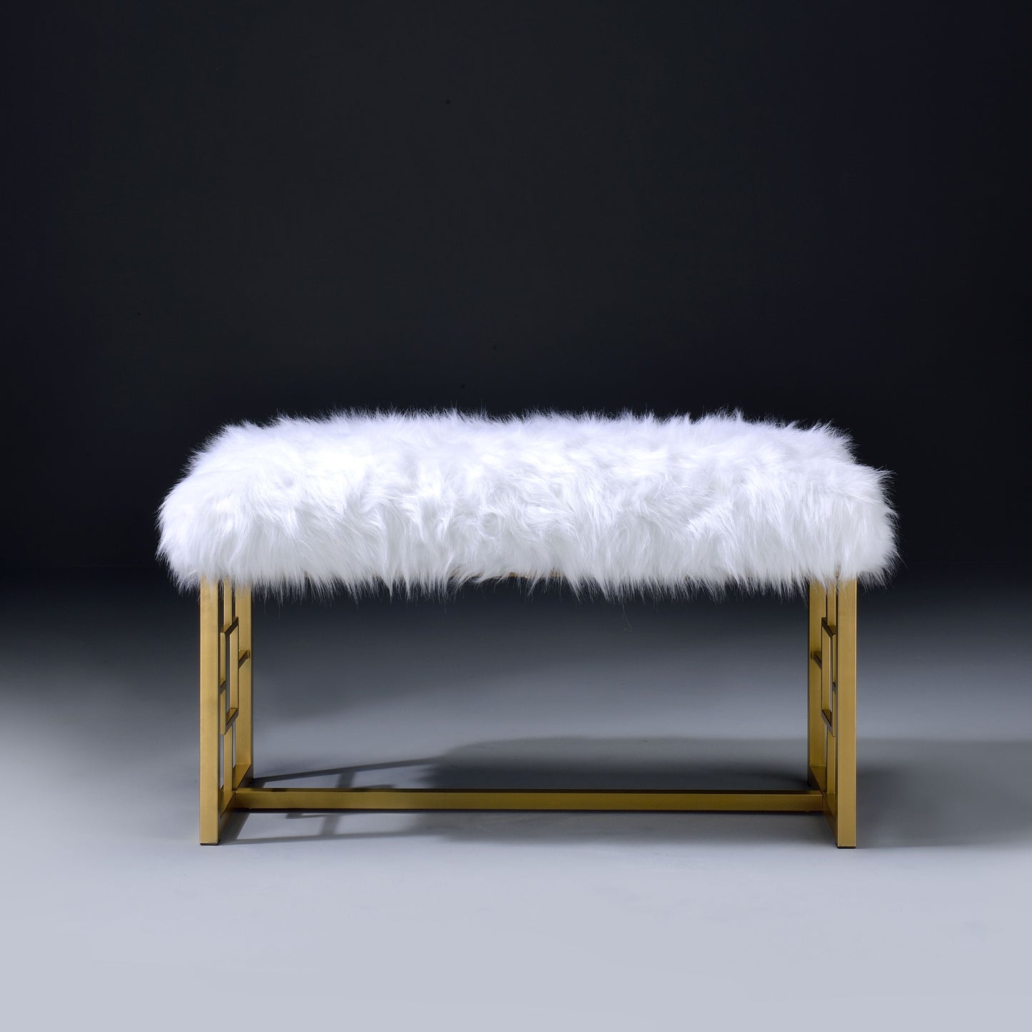 Plush white faux fur accent bench with geometric gold metal legs