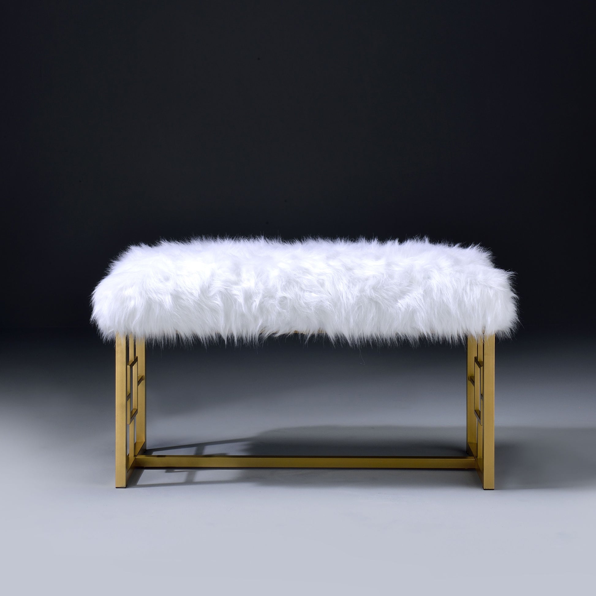 Plush white faux fur accent bench with geometric gold metal legs