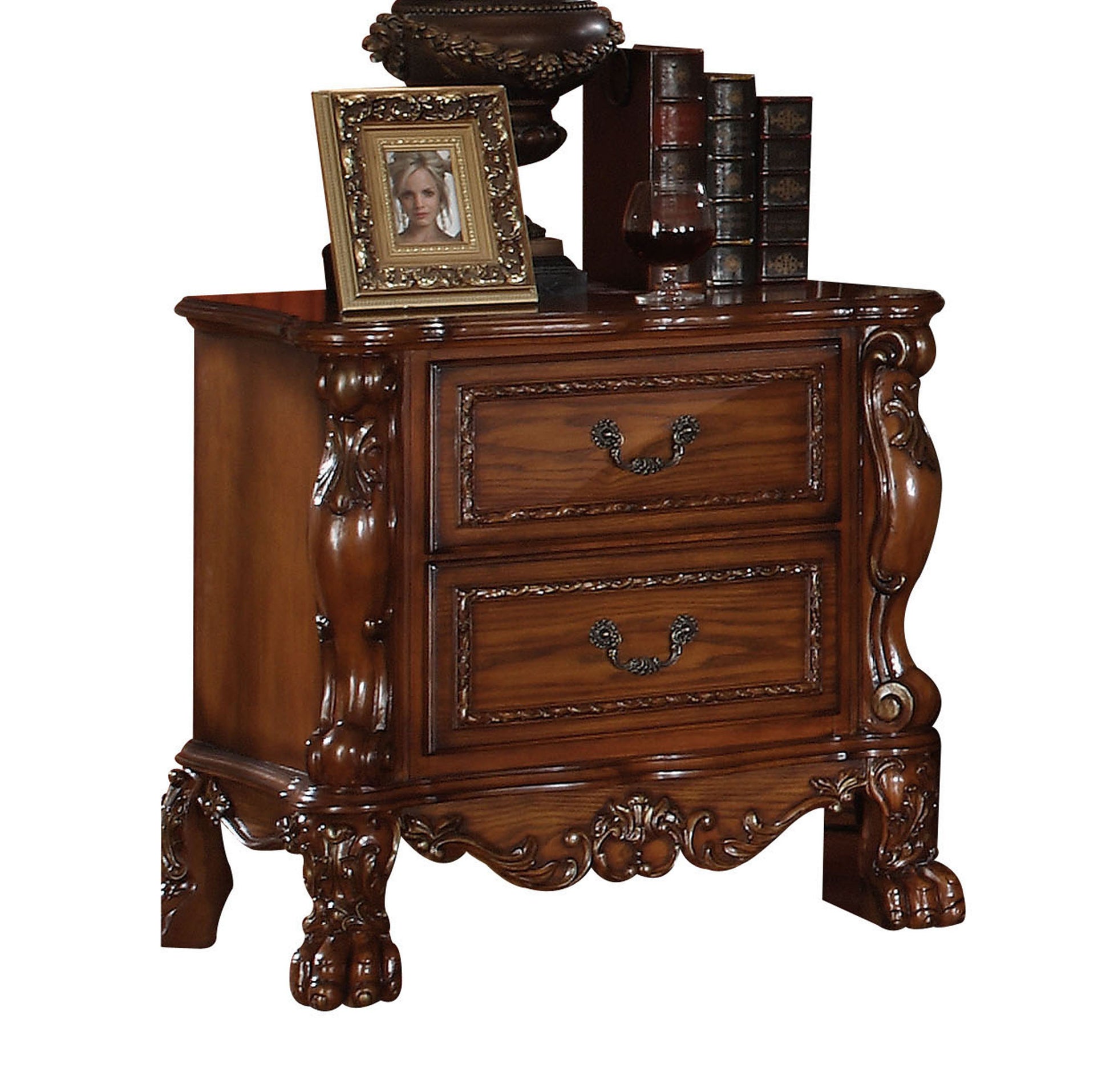 Ornate carved wood nightstand with two drawers and antique brass pulls