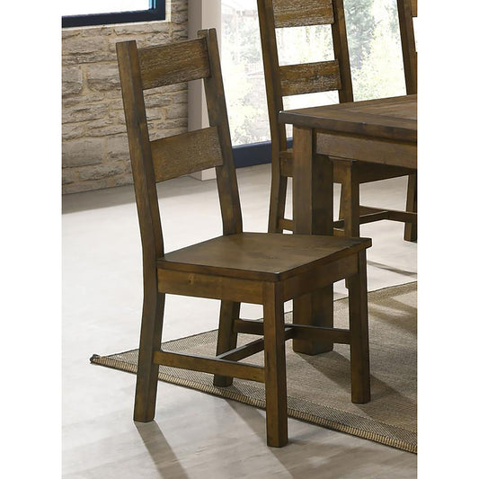 Rustic wooden dining chair with a slatted back and solid seat for a farmhouse kitchen