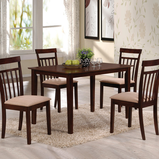 Dark wood dining table set with four slatted back chairs perfect for modern kitchens