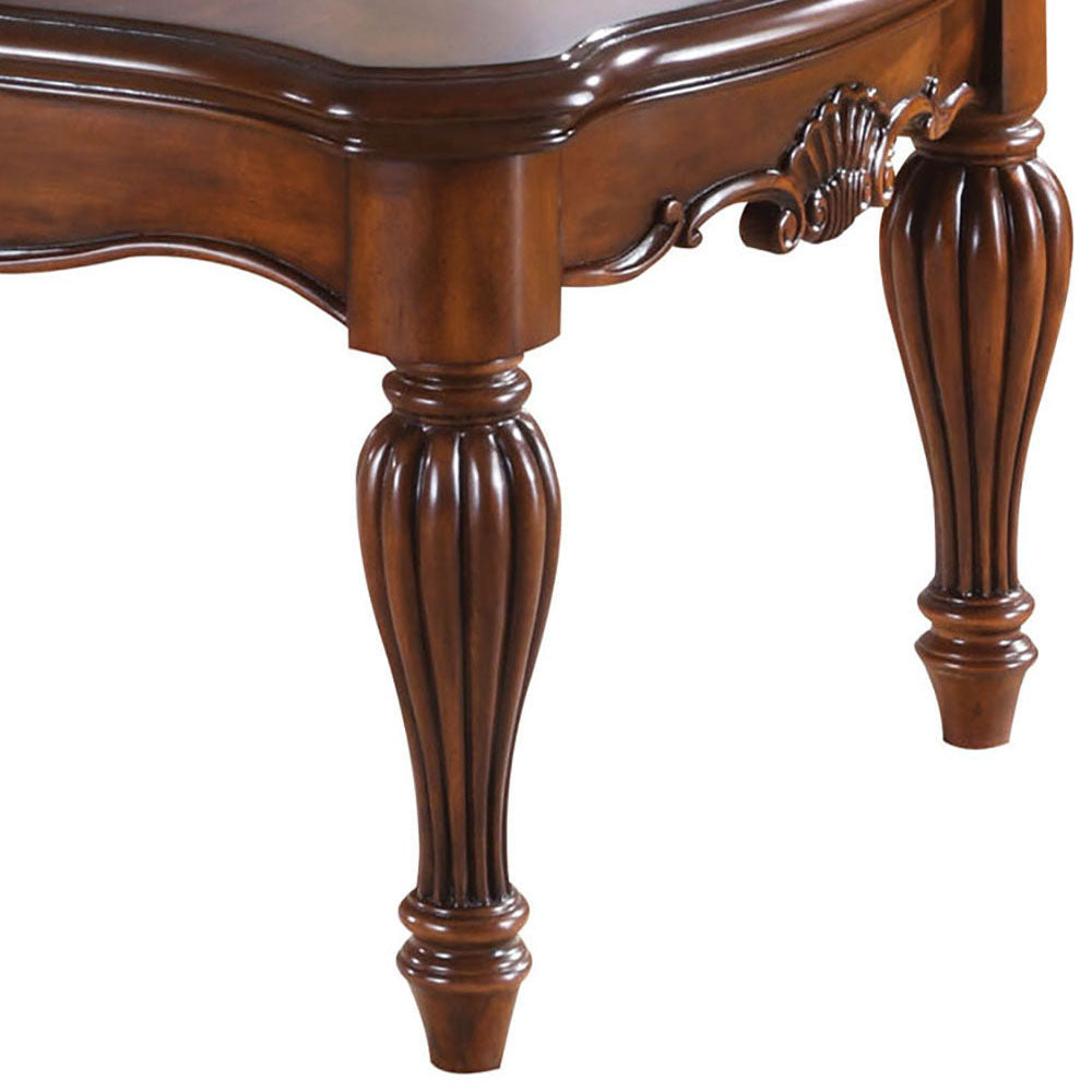 Elegant fluted dark wood table leg with ornate carved detailing suitable for dining tables