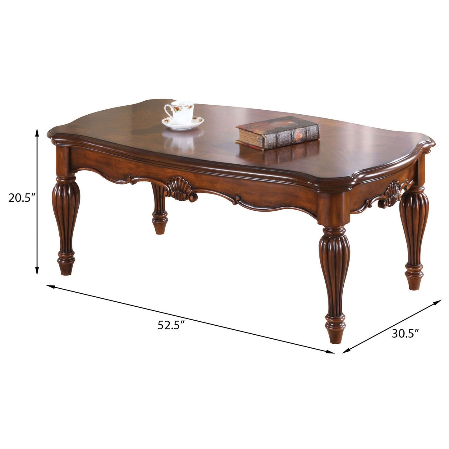Antique mahogany coffee table with carved detailing and ornate legs featuring a book and teacup