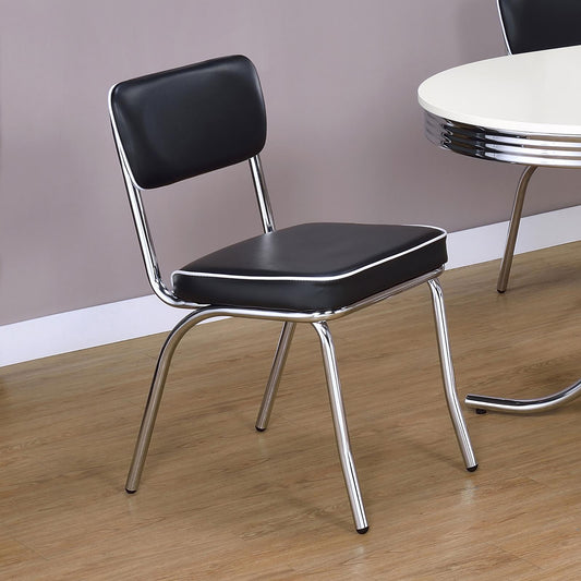 Black vinyl retro diner chair with white piping and chrome legs perfect for a kitchen nook