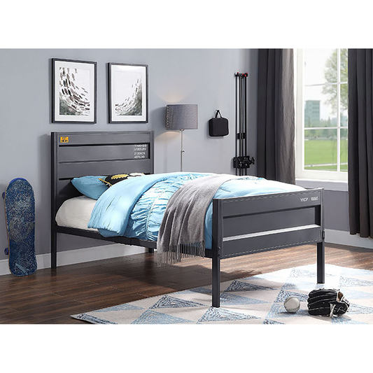 Dark grey metal twin bed frame with blue bedding and a grey throw blanket