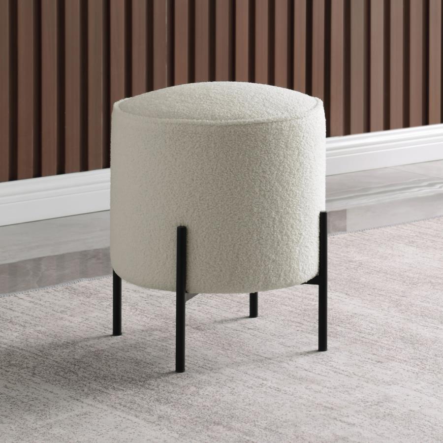 Cream boucle ottoman with black metal legs perfect for modern living rooms