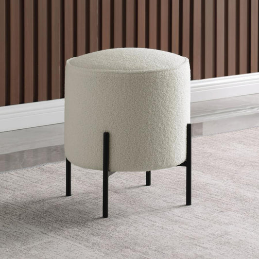 Cream boucle ottoman with black metal legs perfect for modern living rooms