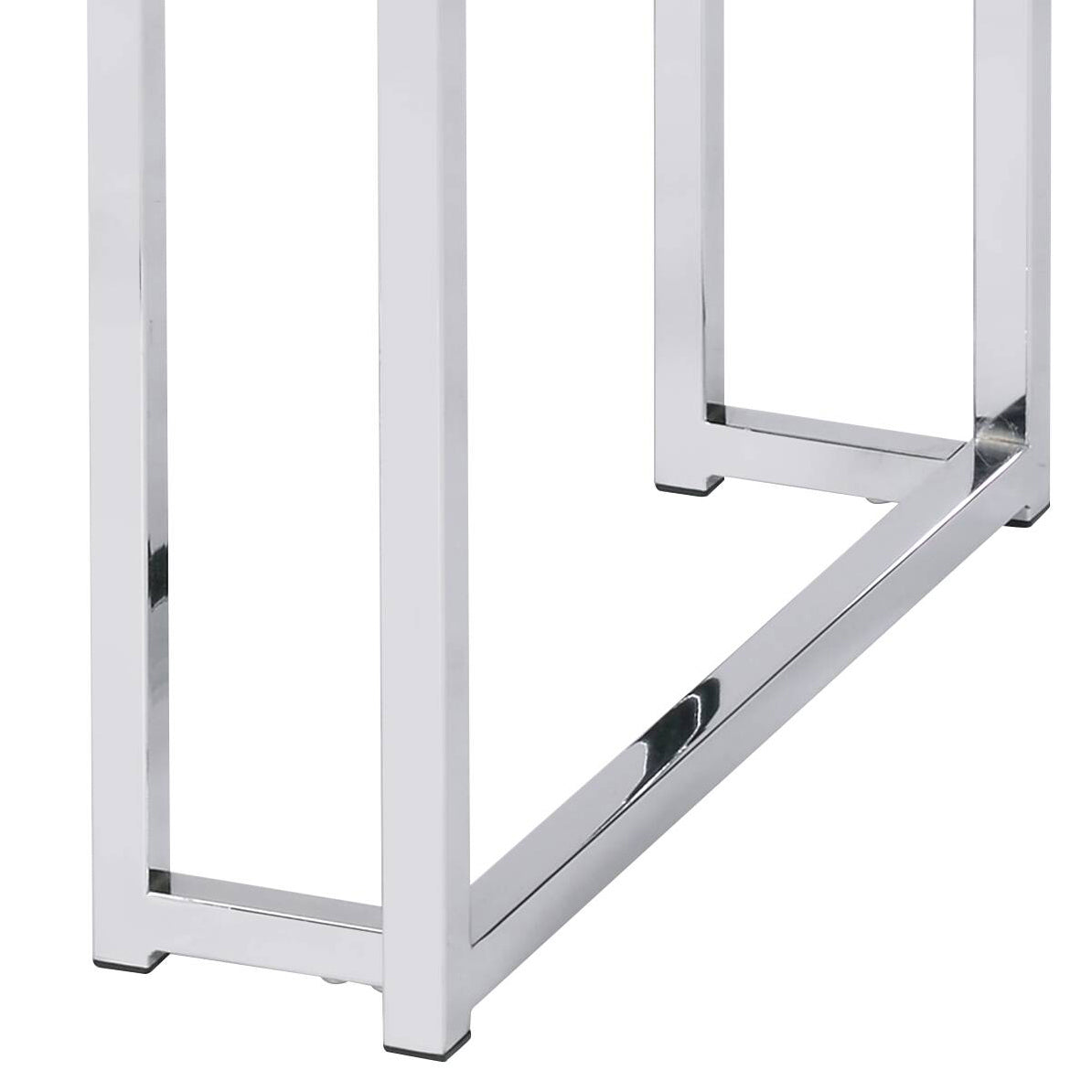 Shiny chrome metal legs of a modern coffee table