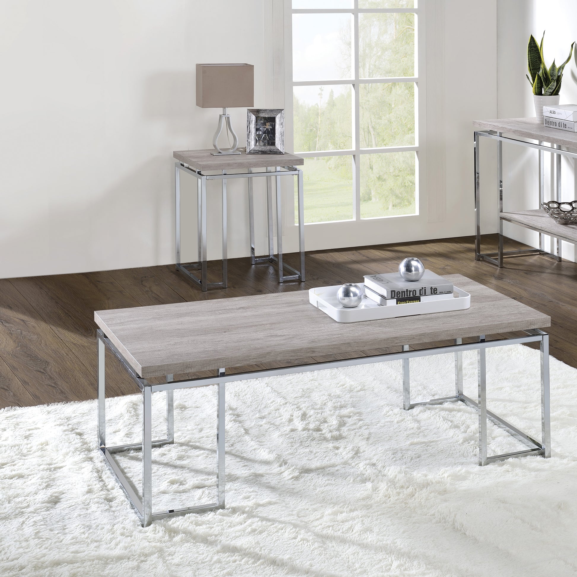 Modern gray wood grain coffee table with chrome legs and silver decorative spheres