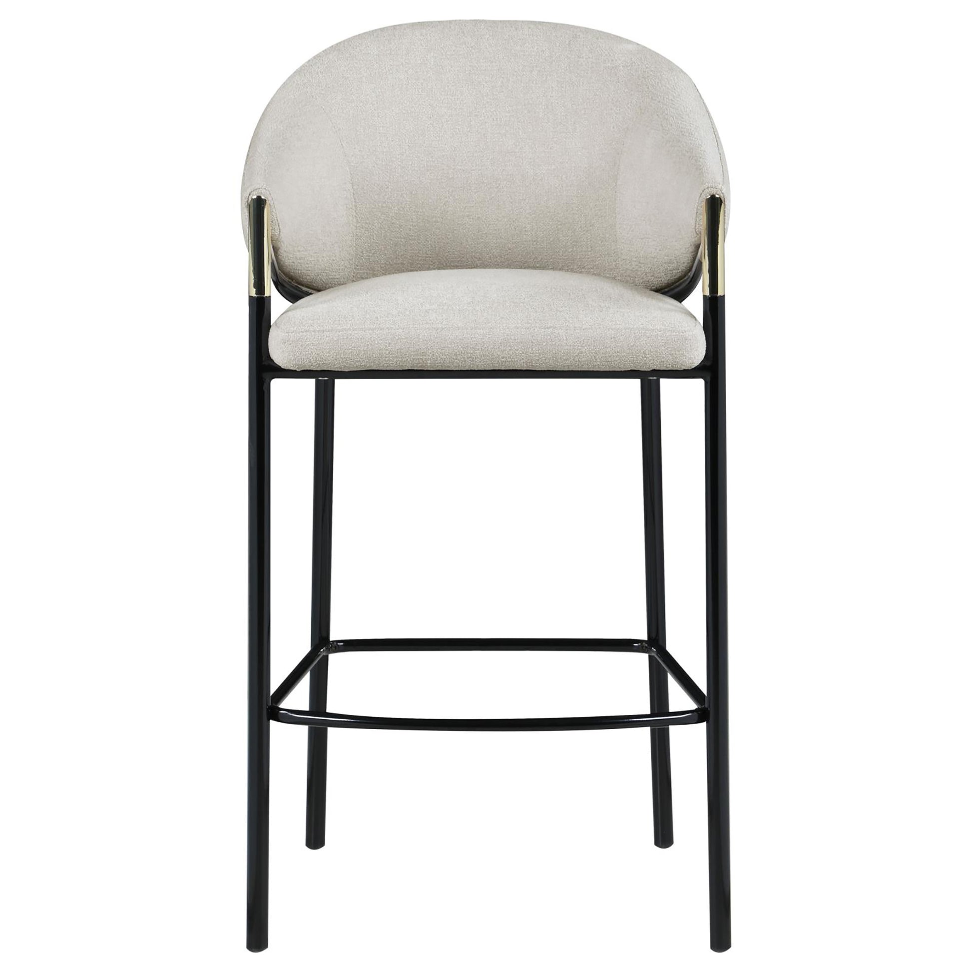 Light beige upholstered bar stool with curved back and black metal legs with gold accents